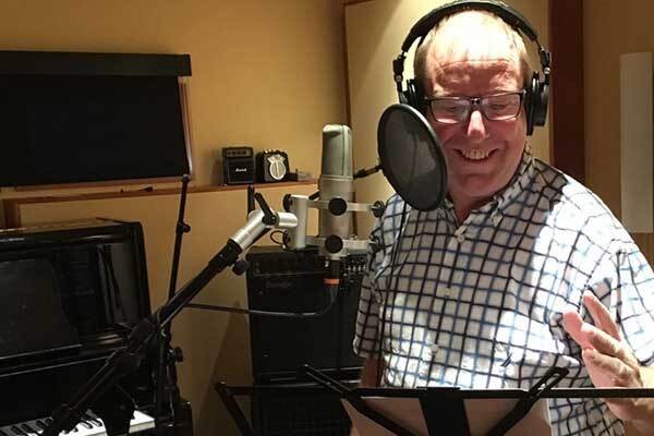 Canadian male voice talent performs audiobook in home studio.