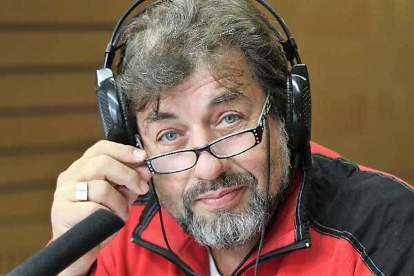Bearded Male Czech voice-over talent with glasses and headphones.