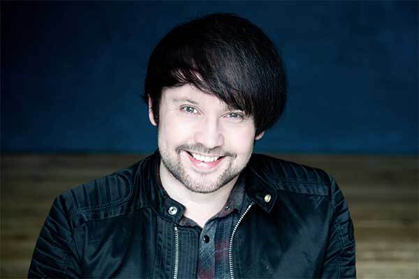 Welsh male voice-over talent smiles outside studio.